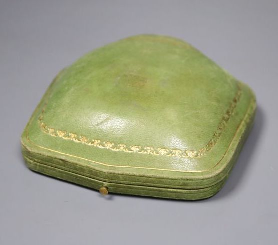 An early 20th century German jugendstil 585 yellow metal and facetted garnet set brooch,